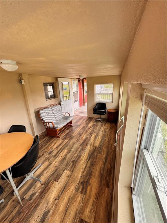 15823 Colorado Pl, Princeton, MO 64673 - living area featuring dark wood finished floors and a textured ceiling