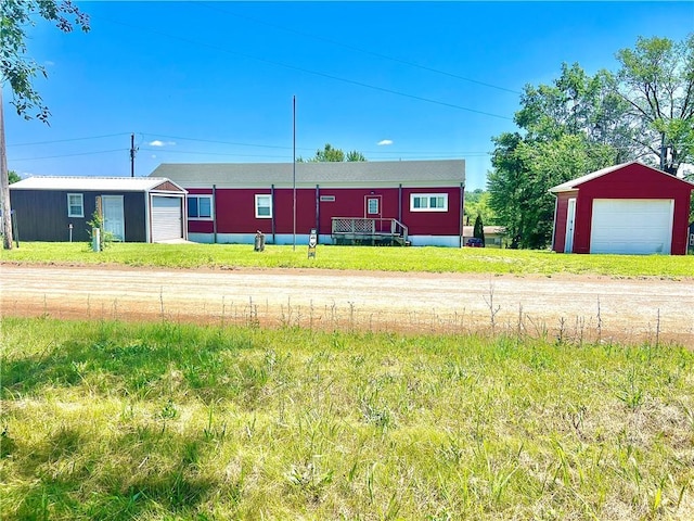 15823 Colorado Pl, Princeton, MO 64673 - view of front facade featuring a garage and an outdoor structure