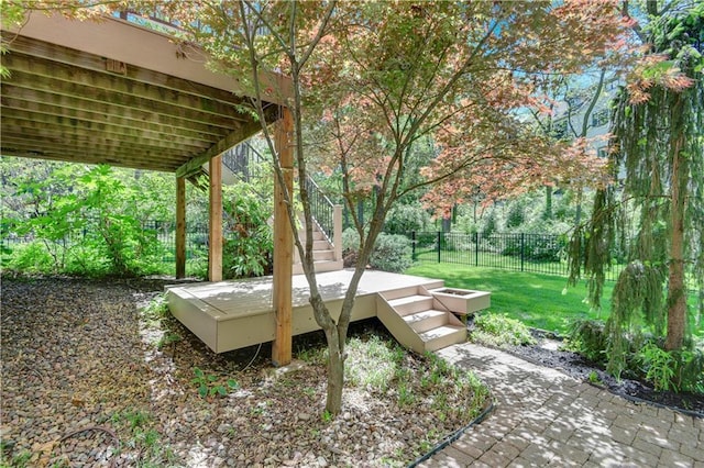 view of yard with stairs and a wooden deck