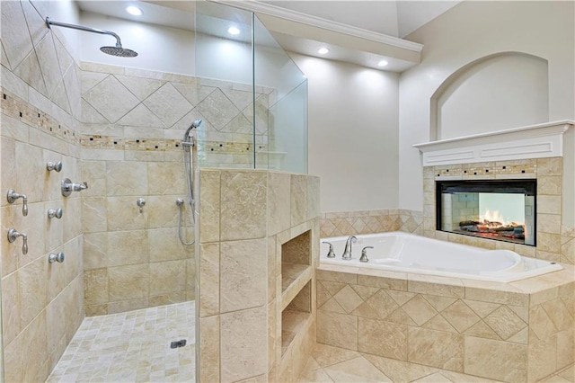 full bathroom featuring a fireplace, a bath, a tile shower, and recessed lighting