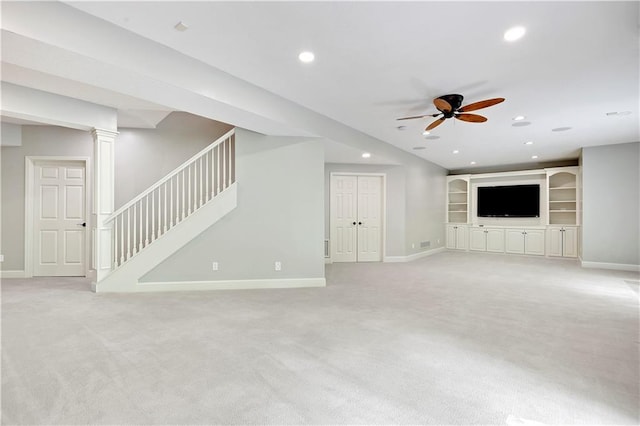 unfurnished living room with light colored carpet, stairway, ceiling fan, baseboards, and recessed lighting