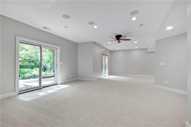 spare room with light colored carpet, baseboards, ceiling fan, and recessed lighting