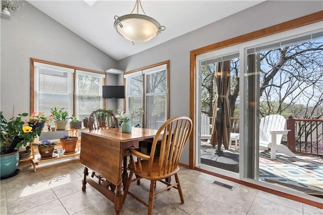 6732 Clairborne Rd, Shawnee, KS 66217 - dining space with lofted ceiling and light tile patterned floors