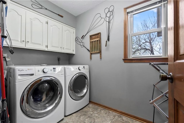 6732 Clairborne Rd, Shawnee, KS 66217 - laundry area featuring cabinet space, washer and dryer, and baseboards