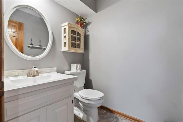 6732 Clairborne Rd, Shawnee, KS 66217 - bathroom featuring toilet, vanity, and baseboards