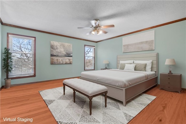 6732 Clairborne Rd, Shawnee, KS 66217 - bedroom featuring ornamental molding, light wood-type flooring, multiple windows, a textured ceiling, and baseboards