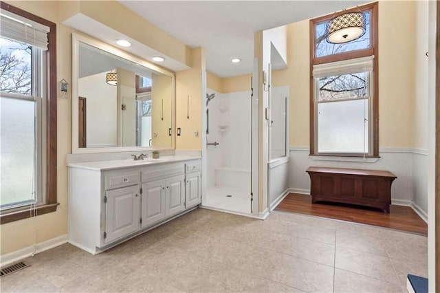 6732 Clairborne Rd, Shawnee, KS 66217 - full bath with vanity, tile patterned floors, a shower stall, and healthy amount of natural light