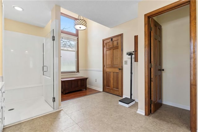 6732 Clairborne Rd, Shawnee, KS 66217 - bathroom featuring a stall shower, vanity, tile patterned floors, and baseboards
