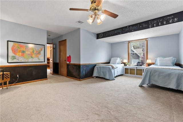 6732 Clairborne Rd, Shawnee, KS 66217 - carpeted bedroom featuring a textured ceiling and a ceiling fan