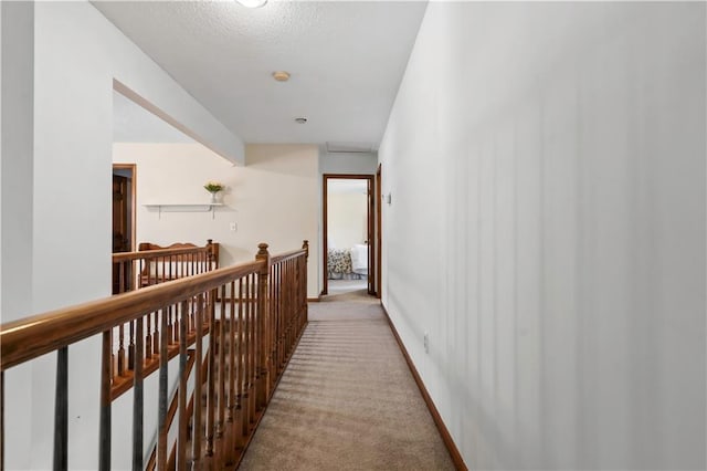 6732 Clairborne Rd, Shawnee, KS 66217 - hall featuring an upstairs landing, light colored carpet, and a textured ceiling