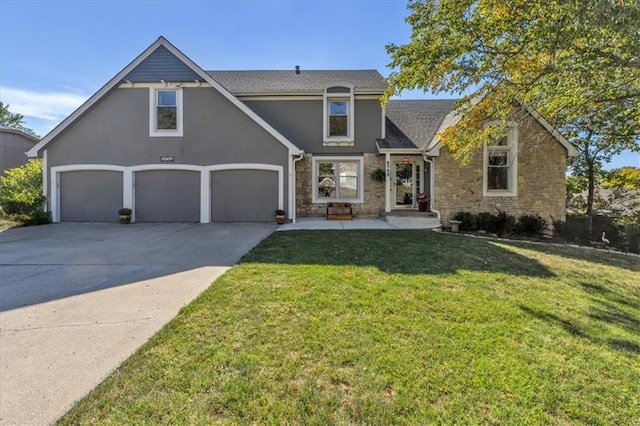 6732 Clairborne Rd, Shawnee, KS 66217 - view of front facade with stone siding, a front yard, concrete driveway, stucco siding, and an attached garage