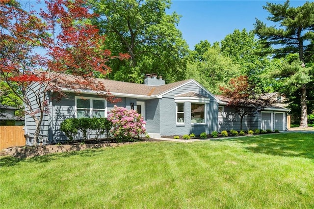 9440 Manor Rd, Leawood, KS 66206 - single story home with a garage and a chimney