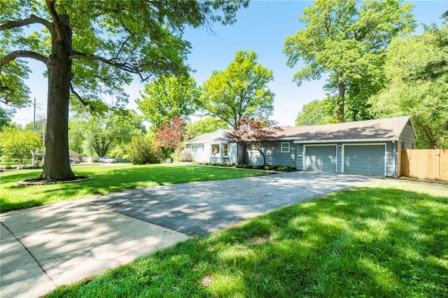 9440 Manor Rd, Leawood, KS 66206 - ranch-style house featuring an attached garage and concrete driveway