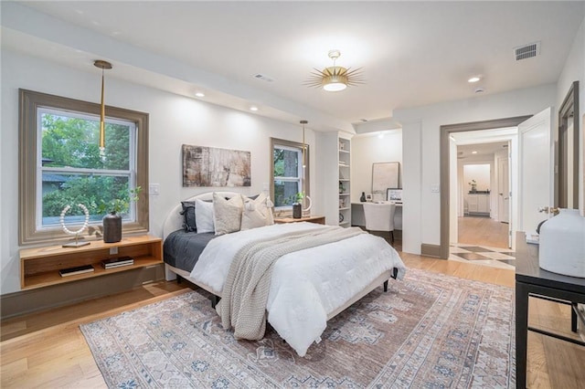 9440 Manor Rd, Leawood, KS 66206 - bedroom with light wood-type flooring and recessed lighting