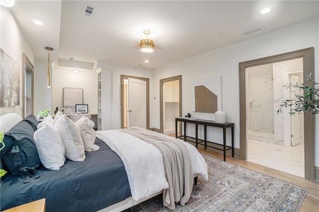 9440 Manor Rd, Leawood, KS 66206 - bedroom with wood finished floors, recessed lighting, and ensuite bathroom