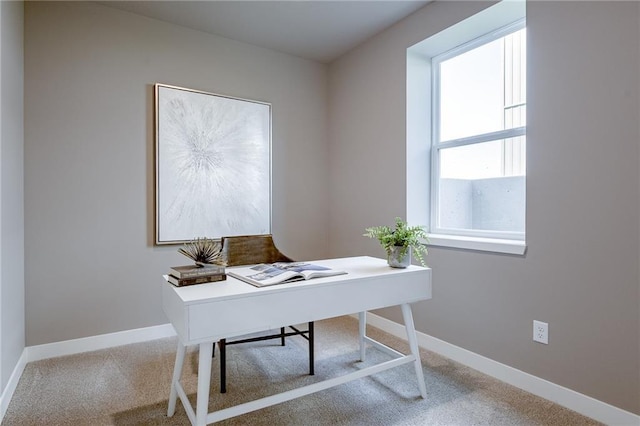 office space with carpet and baseboards