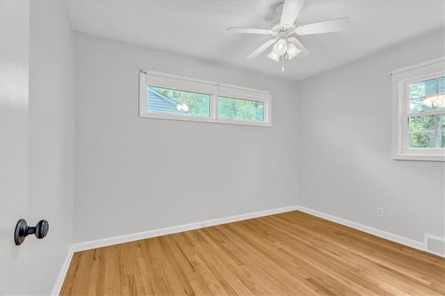 7934 Maple St, Prairie Village, KS 66208 - empty room with light wood-type flooring, baseboards, a textured ceiling, and a ceiling fan