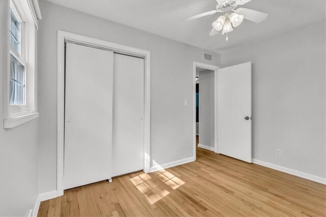 7934 Maple St, Prairie Village, KS 66208 - unfurnished bedroom with baseboards, light wood-type flooring, a closet, and a ceiling fan