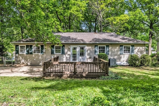 7934 Maple St, Prairie Village, KS 66208 - rear view of house with a lawn, a deck, and cooling unit