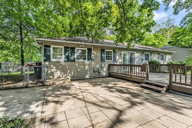 7934 Maple St, Prairie Village, KS 66208 - back of property featuring a deck, a gate, and fence