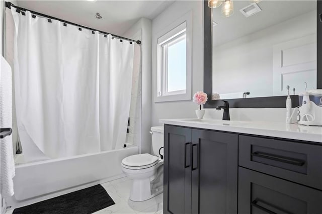 bathroom with visible vents, vanity, toilet, marble finish floor, and shower / tub combo with curtain