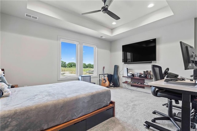 carpeted bedroom with recessed lighting, a ceiling fan, visible vents, and a raised ceiling