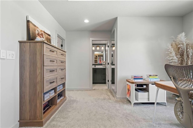 interior space featuring baseboards, light carpet, and recessed lighting