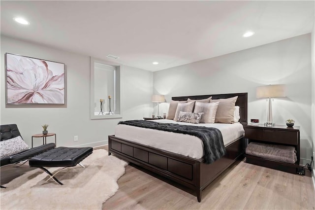 bedroom featuring baseboards, recessed lighting, light wood-style flooring, and visible vents