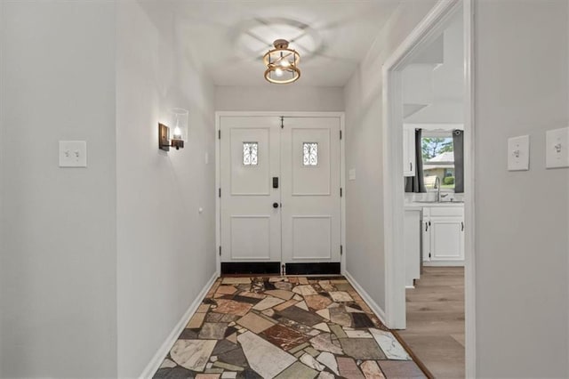 10401 Cypress Dr, Kansas City, MO 64137 - entrance foyer featuring baseboards