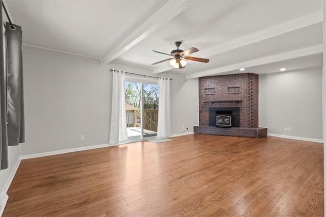 10401 Cypress Dr, Kansas City, MO 64137 - unfurnished living room featuring baseboards, a ceiling fan, beamed ceiling, and wood finished floors