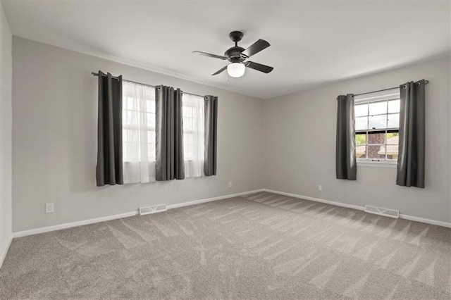 10401 Cypress Dr, Kansas City, MO 64137 - empty room with carpet flooring, baseboards, and visible vents