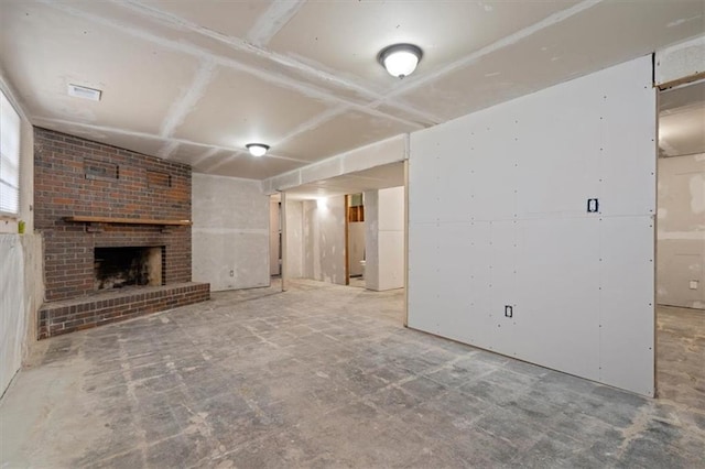 10401 Cypress Dr, Kansas City, MO 64137 - unfurnished living room with a brick fireplace and visible vents