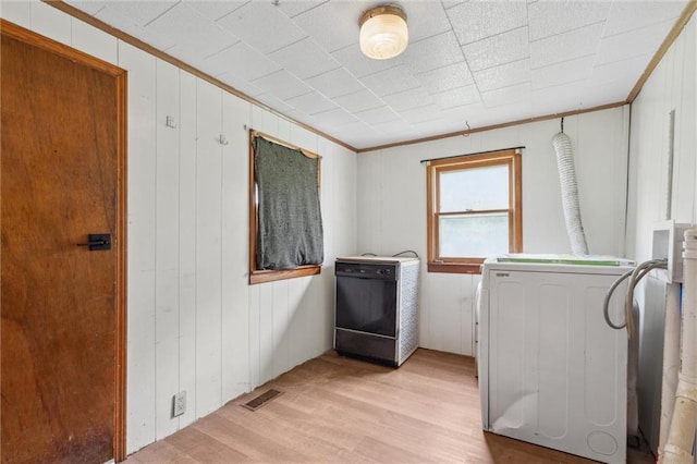 505 W 6th St, Urich, MO 64788 - laundry room featuring hookup for a washing machine, crown molding, light wood-type flooring, and wooden walls