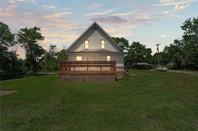 505 W 6th St, Urich, MO 64788 - back of property with a lawn and a wooden deck