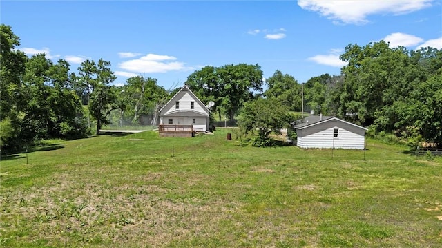 505 W 6th St, Urich, MO 64788 - view of grassy yard with a deck