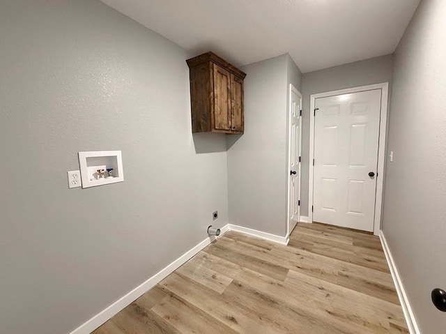 washroom featuring light wood-style floors, washer hookup, baseboards, and electric dryer hookup