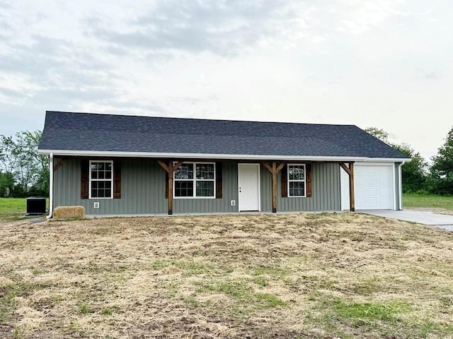 single story home with driveway and a garage