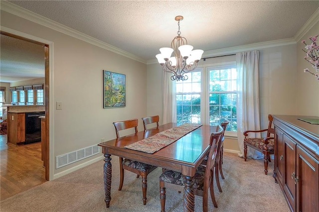 14241 W 113th Ter, Olathe, KS 66062 - dining area featuring a chandelier, ornamental molding, light colored carpet, a textured ceiling, and baseboards