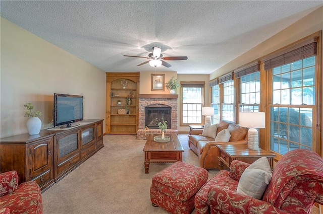 14241 W 113th Ter, Olathe, KS 66062 - living room with light colored carpet, ceiling fan, a textured ceiling, a fireplace, and built in shelves