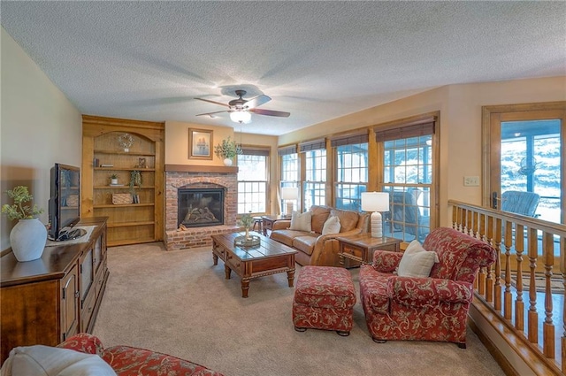 14241 W 113th Ter, Olathe, KS 66062 - carpeted living room featuring a ceiling fan, a textured ceiling, and a fireplace