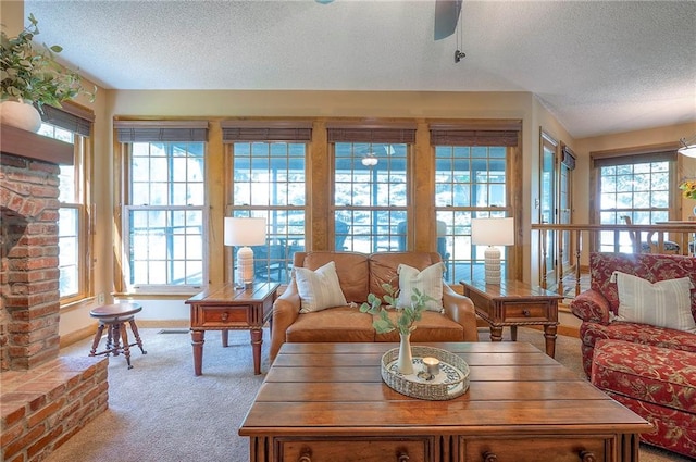 14241 W 113th Ter, Olathe, KS 66062 - carpeted living area featuring a textured ceiling, ceiling fan, and baseboards