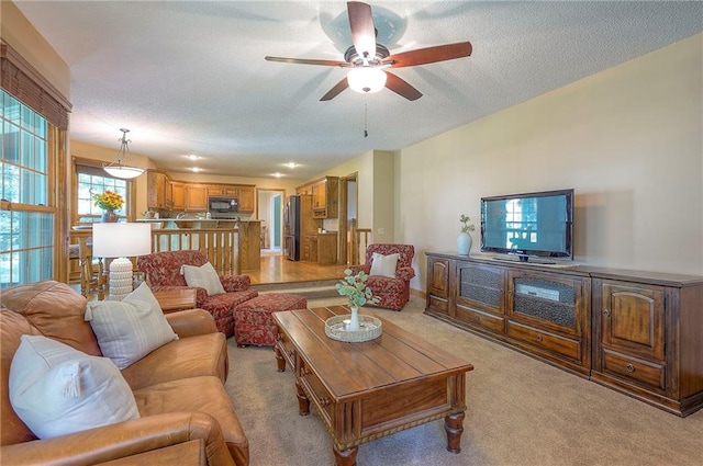 14241 W 113th Ter, Olathe, KS 66062 - living area with a ceiling fan, light colored carpet, and a textured ceiling