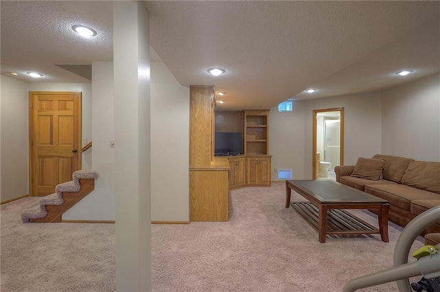 14241 W 113th Ter, Olathe, KS 66062 - living area featuring light carpet, a textured ceiling, recessed lighting, stairs, and baseboards