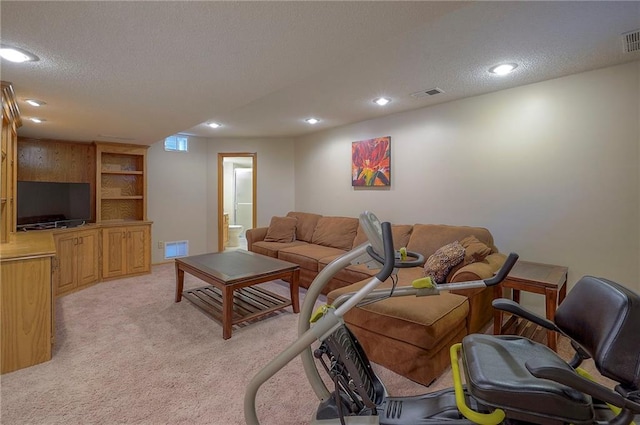 14241 W 113th Ter, Olathe, KS 66062 - living area with recessed lighting, light colored carpet, and a textured ceiling