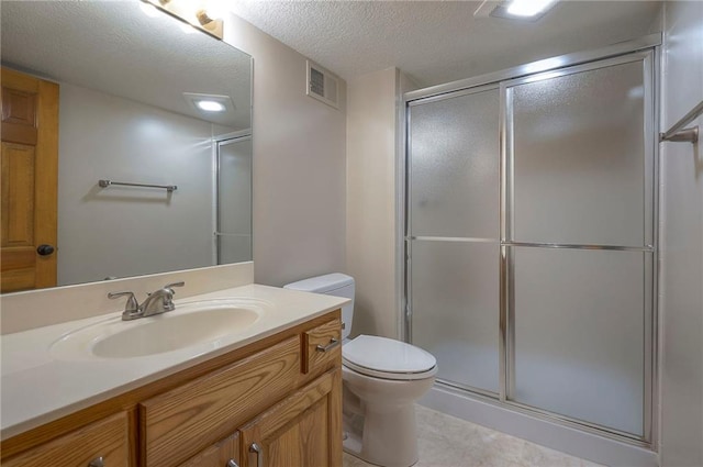 14241 W 113th Ter, Olathe, KS 66062 - full bath with vanity, an enclosed shower, toilet, and a textured ceiling