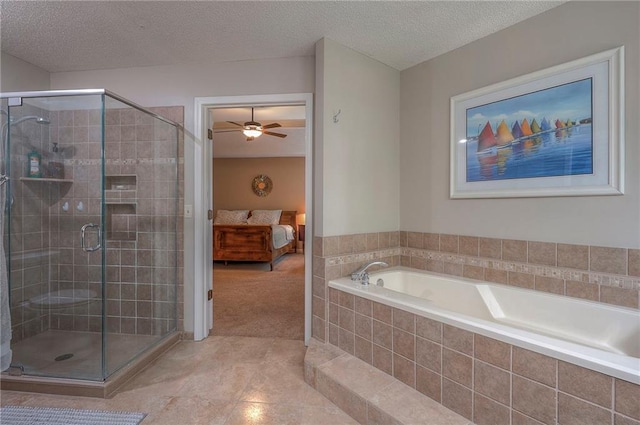 14241 W 113th Ter, Olathe, KS 66062 - full bathroom with ensuite bath, a bath, a shower stall, a ceiling fan, and a textured ceiling