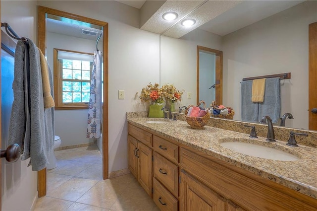 14241 W 113th Ter, Olathe, KS 66062 - full bathroom with double vanity, toilet, tile patterned floors, baseboards, and a shower with shower curtain