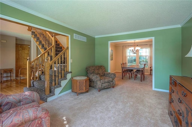 14241 W 113th Ter, Olathe, KS 66062 - living area featuring stairs, a chandelier, crown molding, a textured ceiling, and baseboards