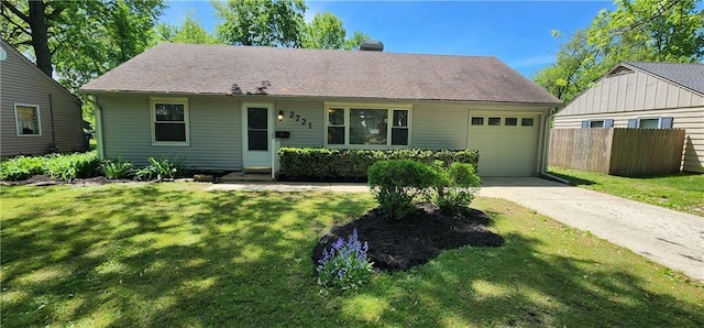 ranch-style house featuring fence, an attached garage, driveway, and a front lawn