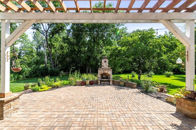 21710 W 61st St, Shawnee, KS 66218 - view of patio / terrace with an outdoor stone fireplace, a pergola, and view of wooded area